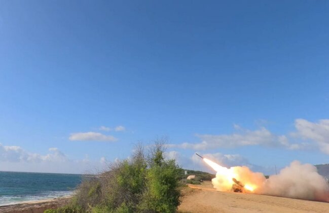 Photo: A High Mobility Artillery Rocket is fired into the ocean