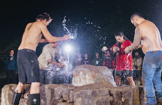 Photo: Members from Ka Pōholima Kāʻeo community group smashed coconuts over the ahu (shrine) that they built on-site