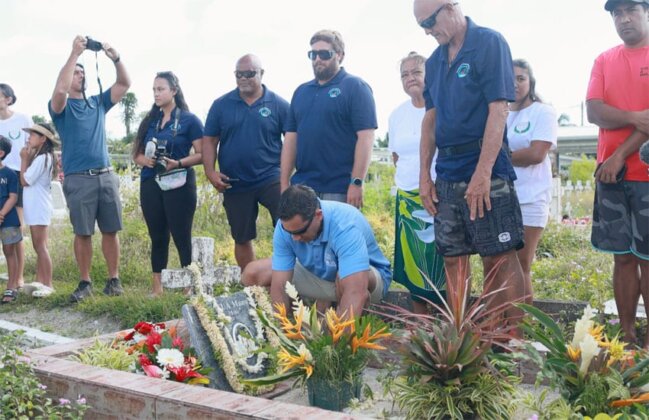 Photo: Festival participants leave flowers at burial site for Tautira kūpuna
