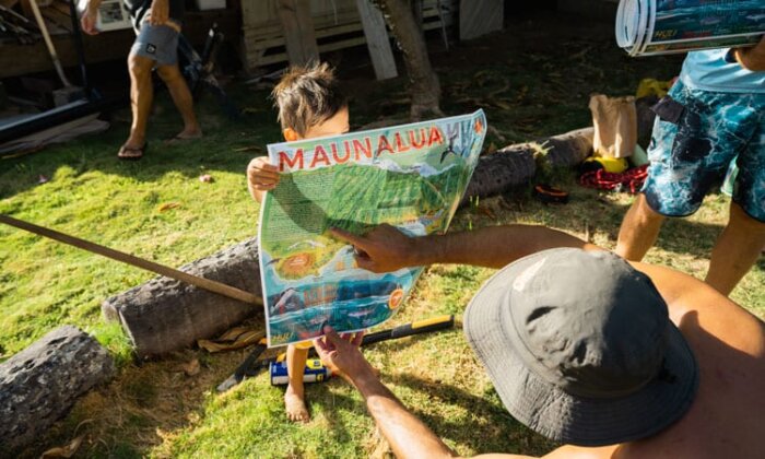 Photo: Keiki holding a mapof Maunalua