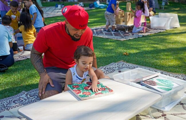 Photo: Father and his keiki piece together a plant puzzle