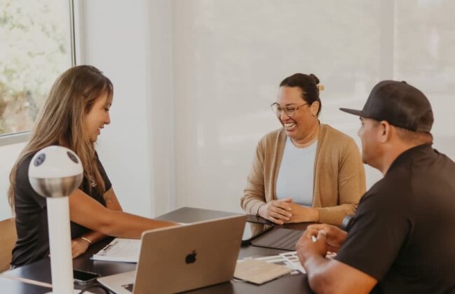 Photo: Waiʻanae Economic Development Council Program Director Shavone Lave (center) conducts a business development coaching session